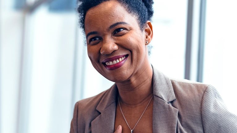 Grateful businesswoman thanking colleague for support and motivation at workplace