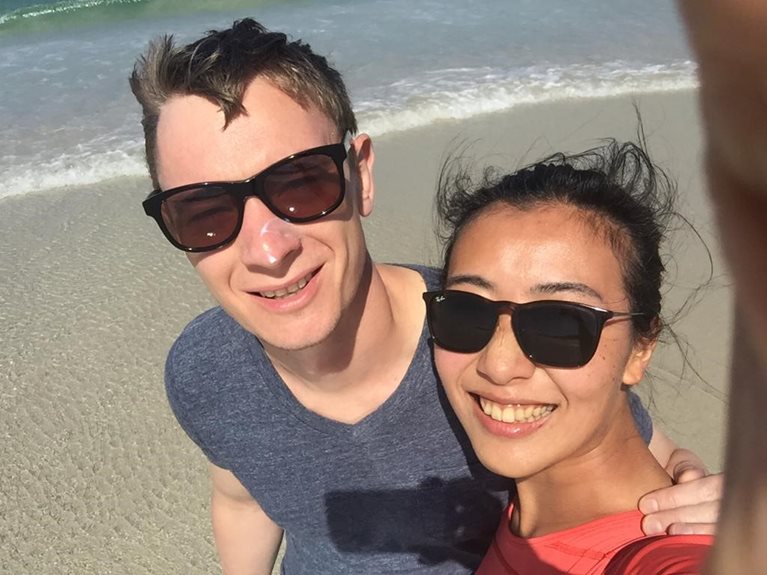 Mina on beach with husband