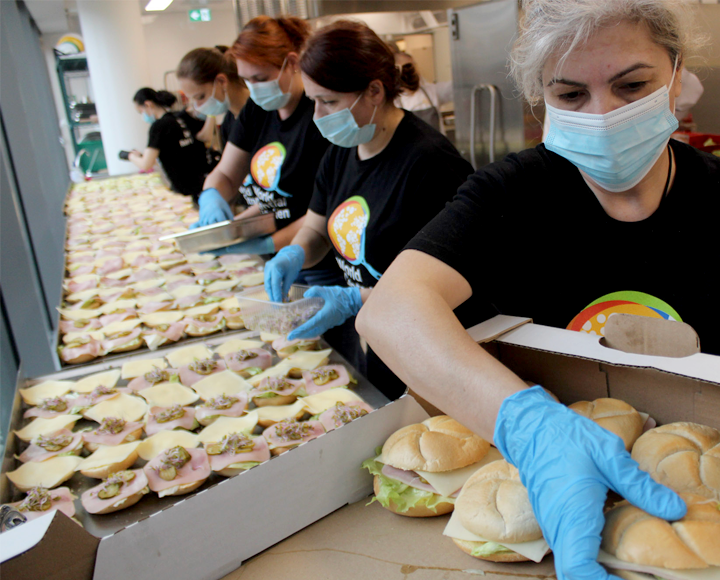 Nonprofit volunteers preparing sandwiches