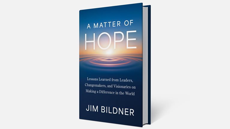 A book titled A Matter of Hope by Jim Bildner is shown against a clean white background, with a cover featuring a glowing horizon and concentric ripples on water.