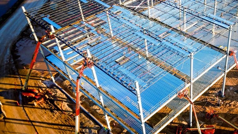 Aerial drone view of an electric vehicle battery factory that is under construction