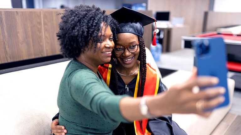 Mother and daughter taking a memorable selfie before the graduation ceremony