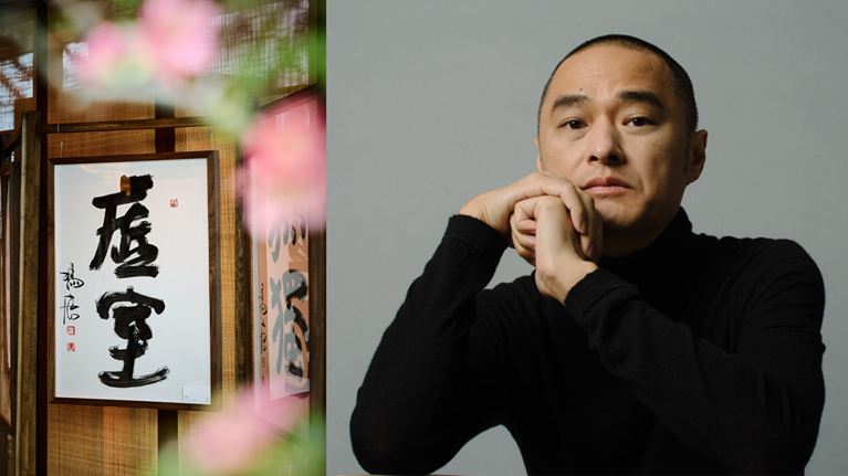 Henry Zhang next to his artwork