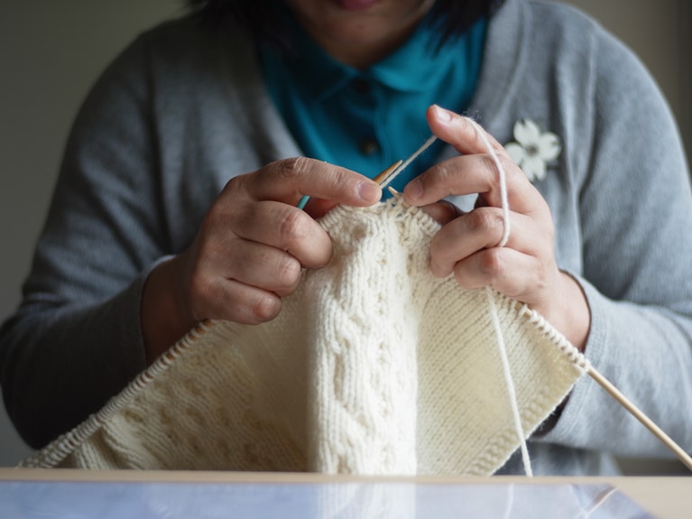 Image of woman knitting