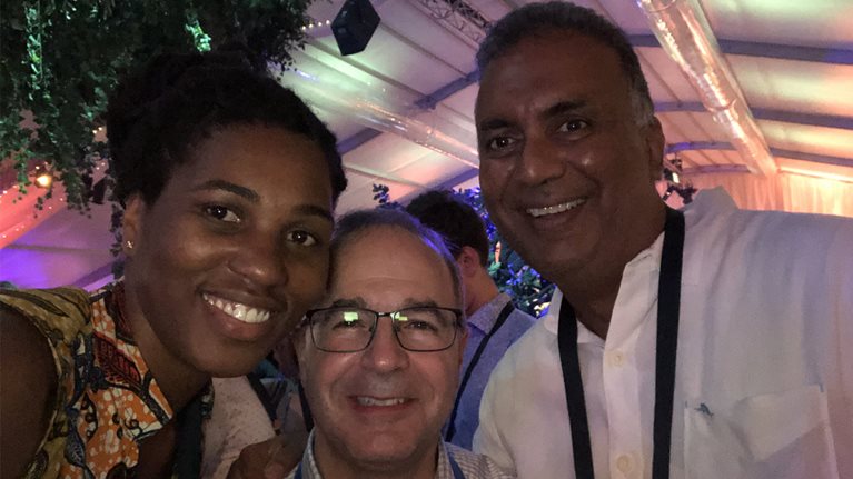 Taiwo Ajayi with global managing partner Kevin Sneader and Ranji Latchmansingh