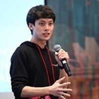 McKinsey alum Shi Khai Wei speaking with a microphone in hand