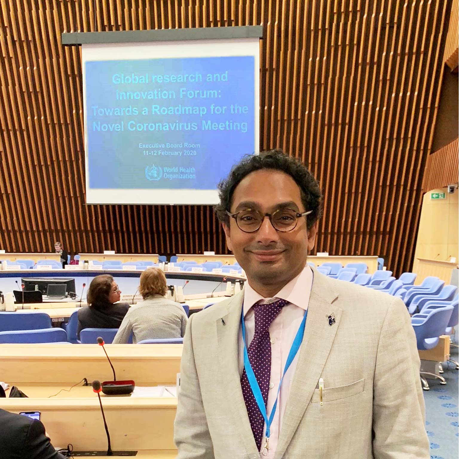 Vas Vasan standing in a conference room