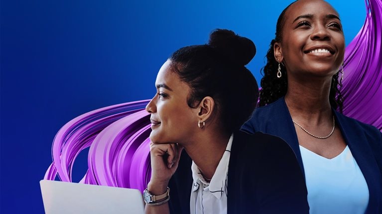 Two women working together on a laptop.