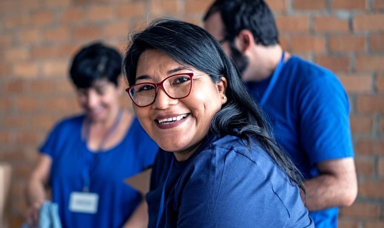 Portrait of a volunteer working in a community charity donation center