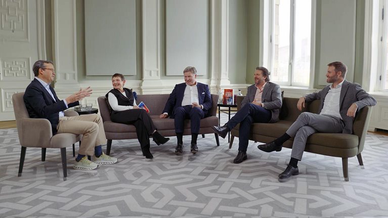 Chris Bradley, Nick Leung, Sven Smit, Janet Bush, and Marc Canal sitting and talking together.