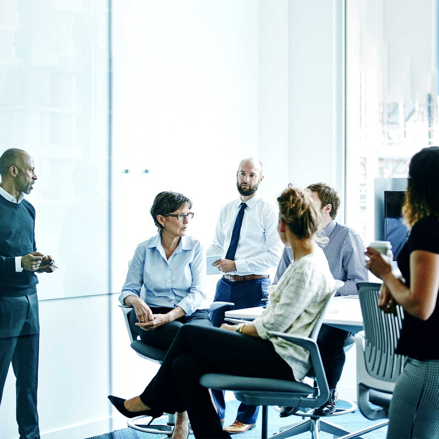 Businesswoman leading team meeting in office