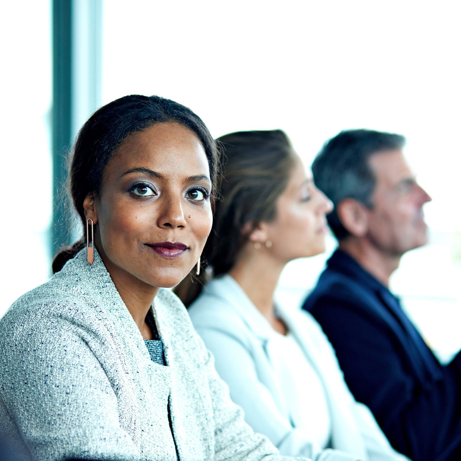 Female black corporate professional stares at camera