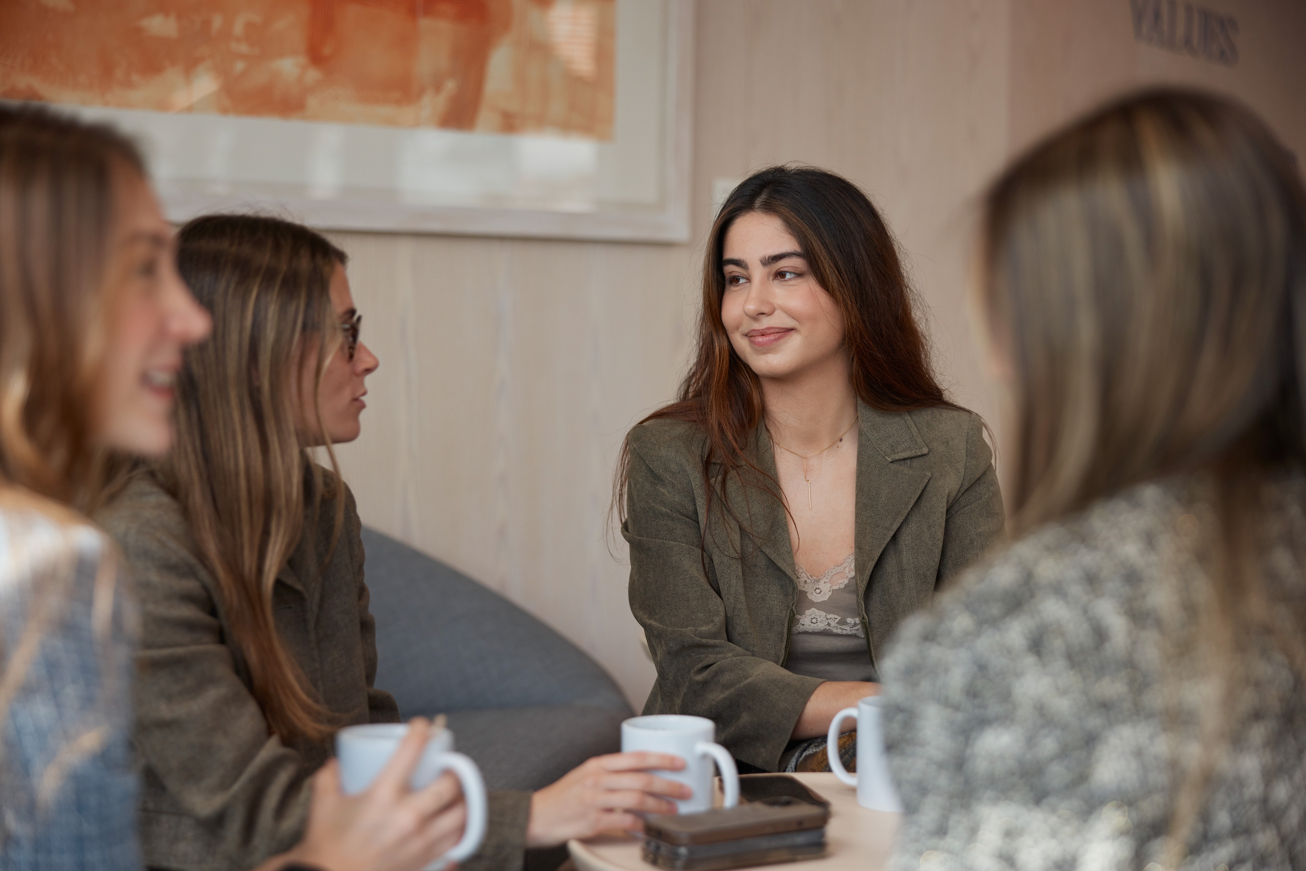 Photo of women sitting down talking