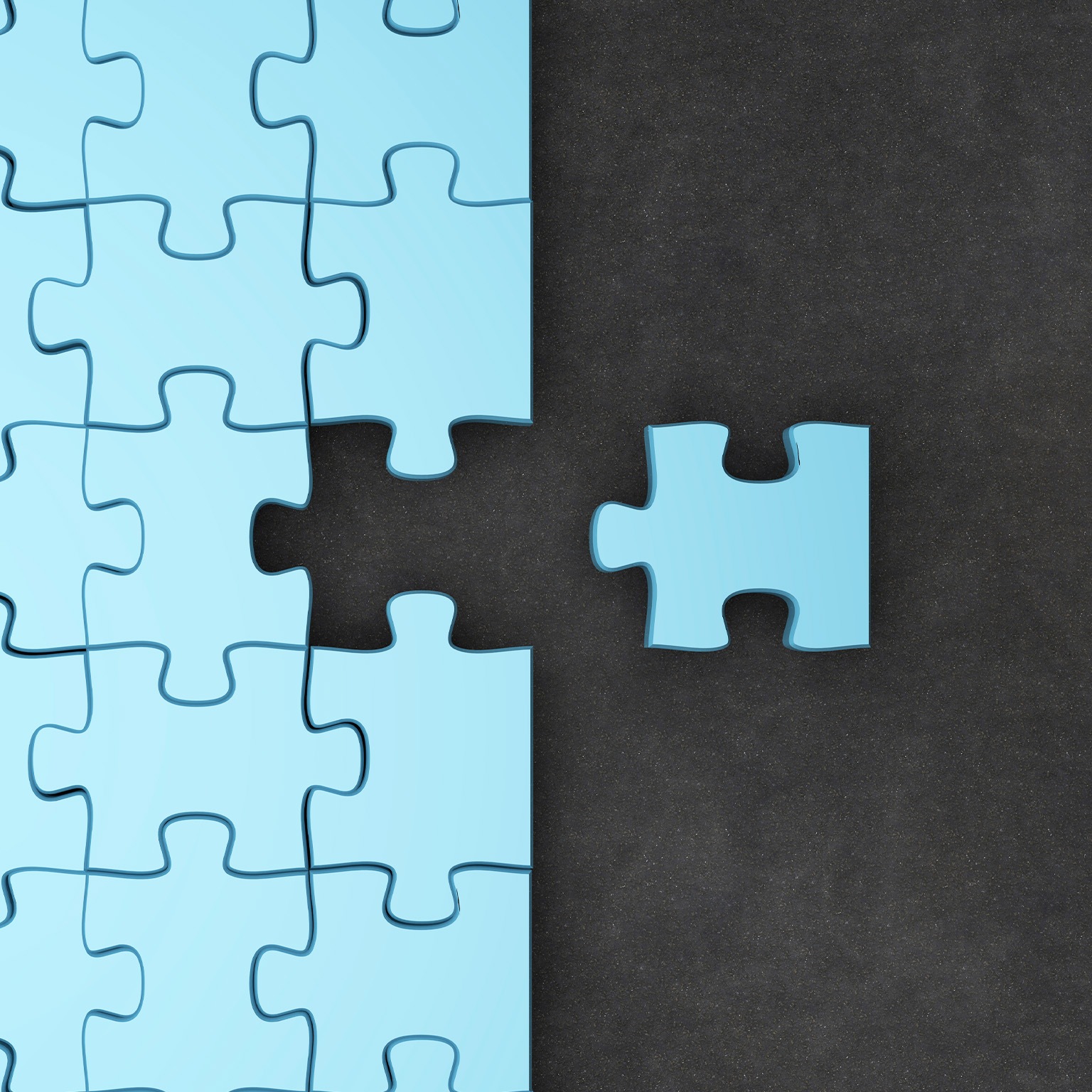 Jigsaw puzzle pieces. One fitting piece sitting outside of nearly completed puzzle.