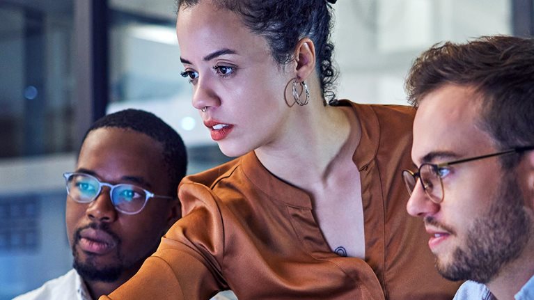 Shot of two young businesspeople looking stressed while working on a computer in the office.