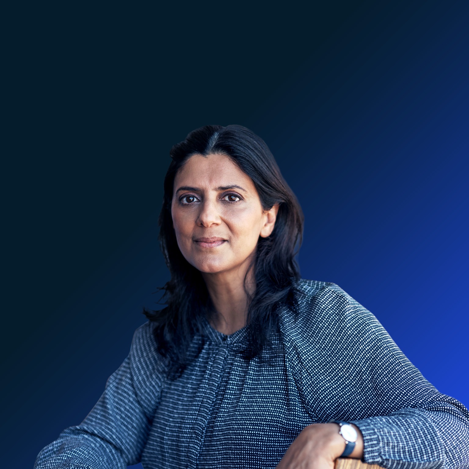 Portrait of a mature businesswoman having a meeting with her team in a modern office