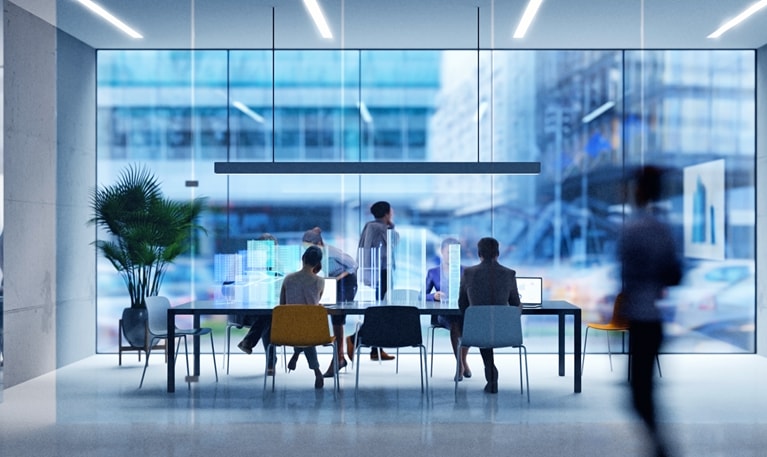 Photo of people sitting at a conference table