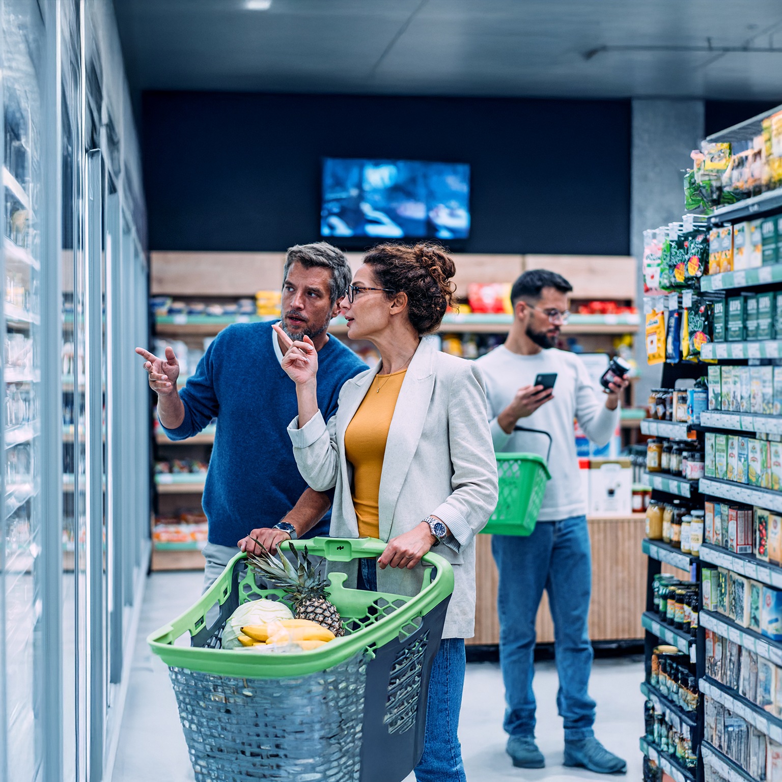 Couple shopping in a grocery store.