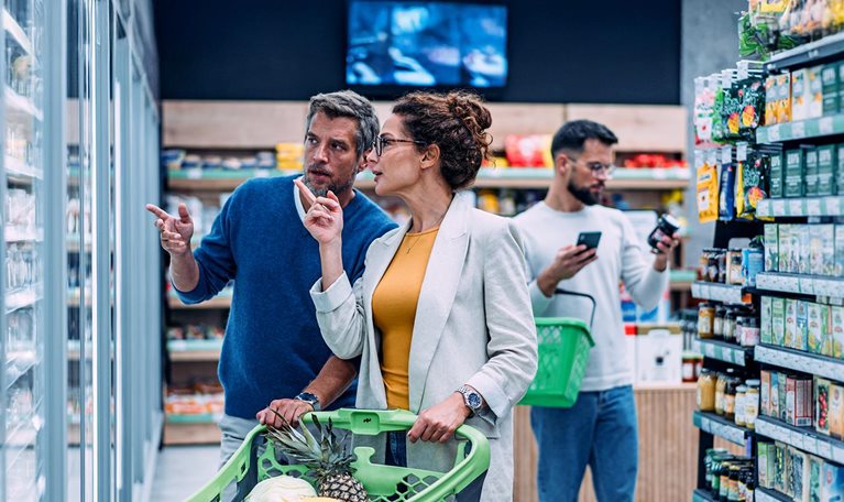 Couple shopping in a grocery store.