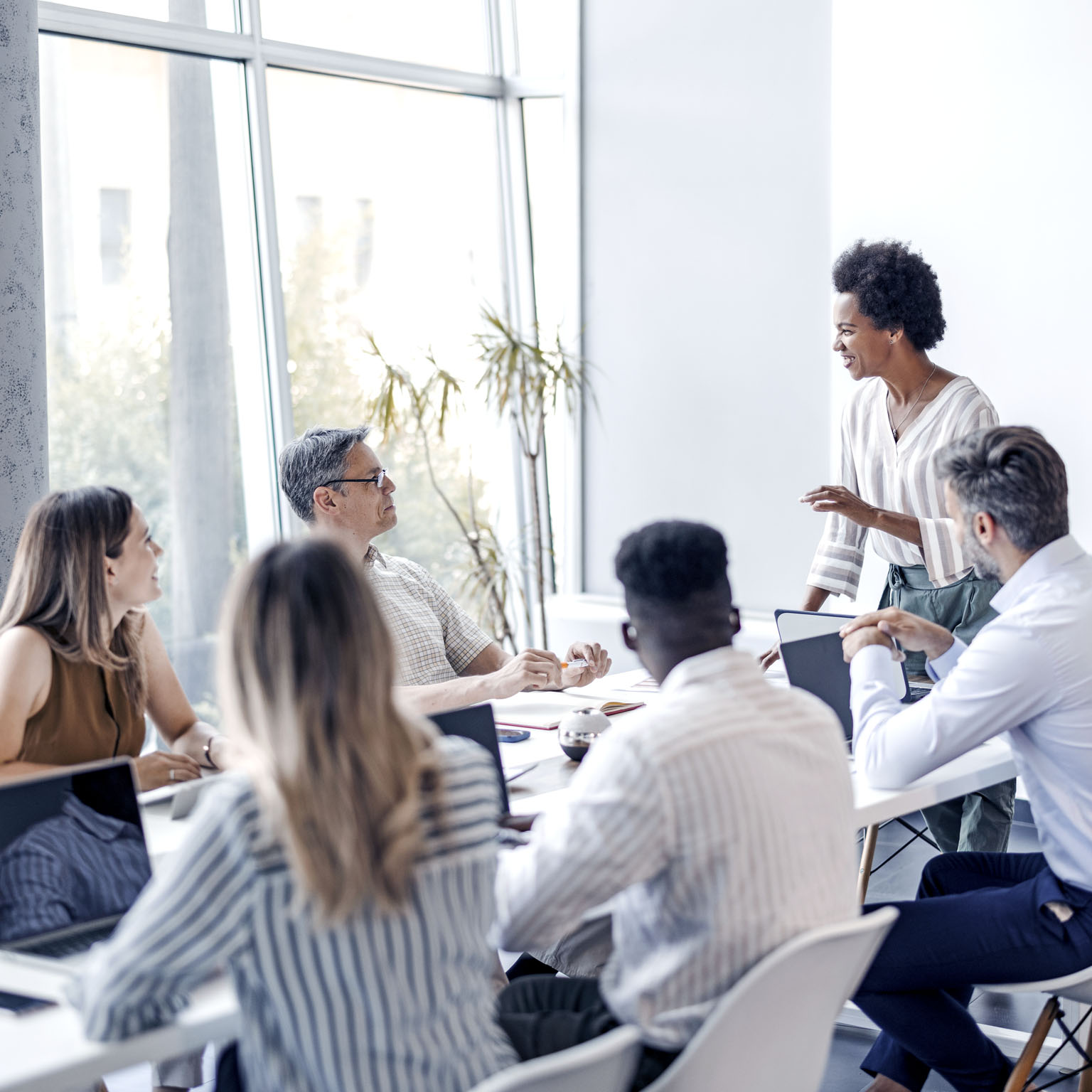 A group of diverse individuals engaged in a business meeting.