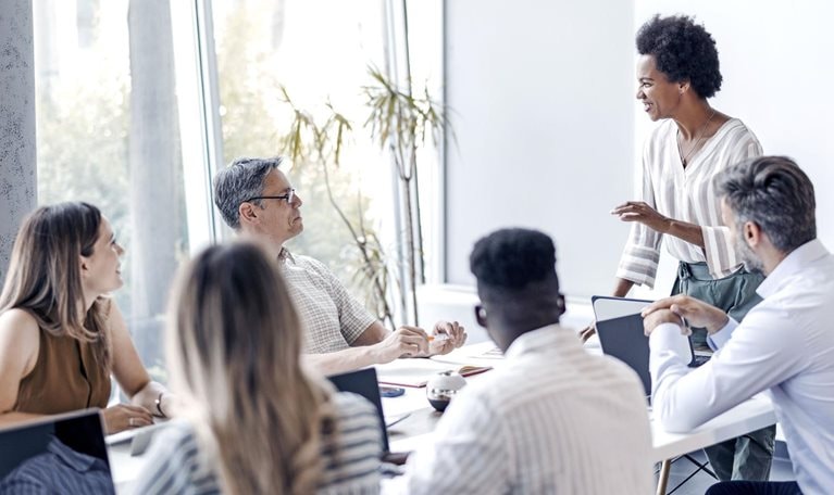 A group of diverse individuals engaged in a business meeting.