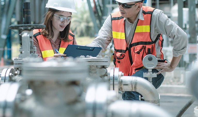 electricity engineer and his supervisor at industrial facility