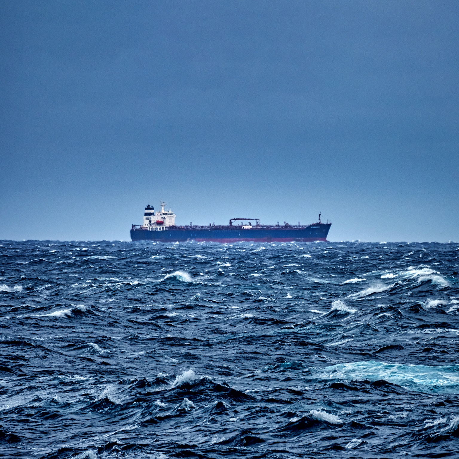 Ship delivering cargo in the stormy Mediterranean sea