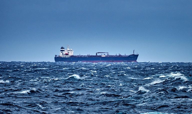 Ship delivering cargo in the stormy Mediterranean sea