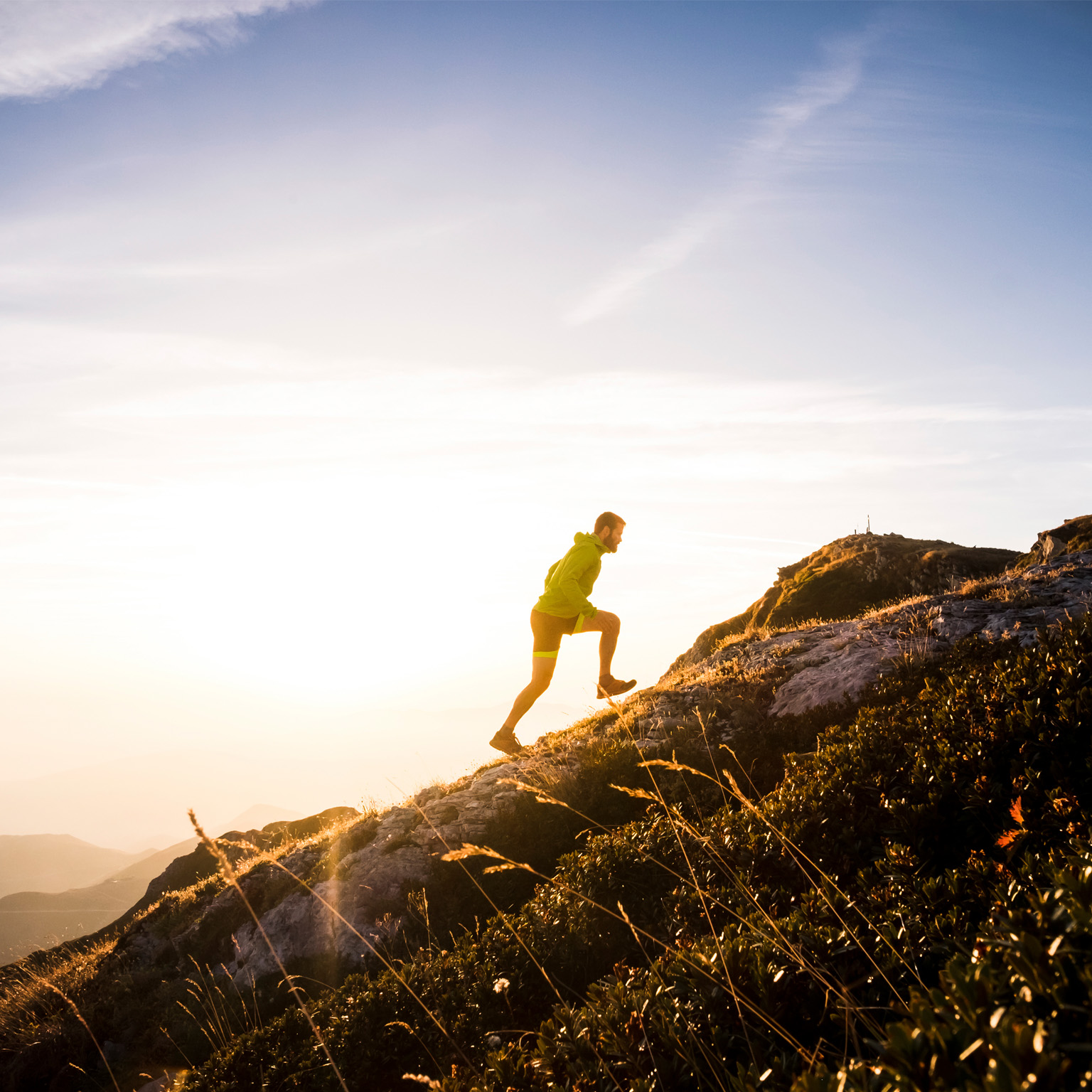 photo man hiking up mountain