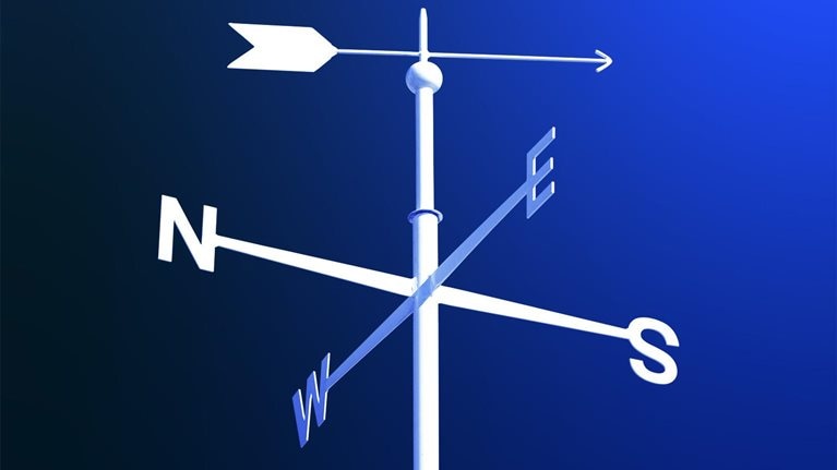 White weathervane on blue gradient background