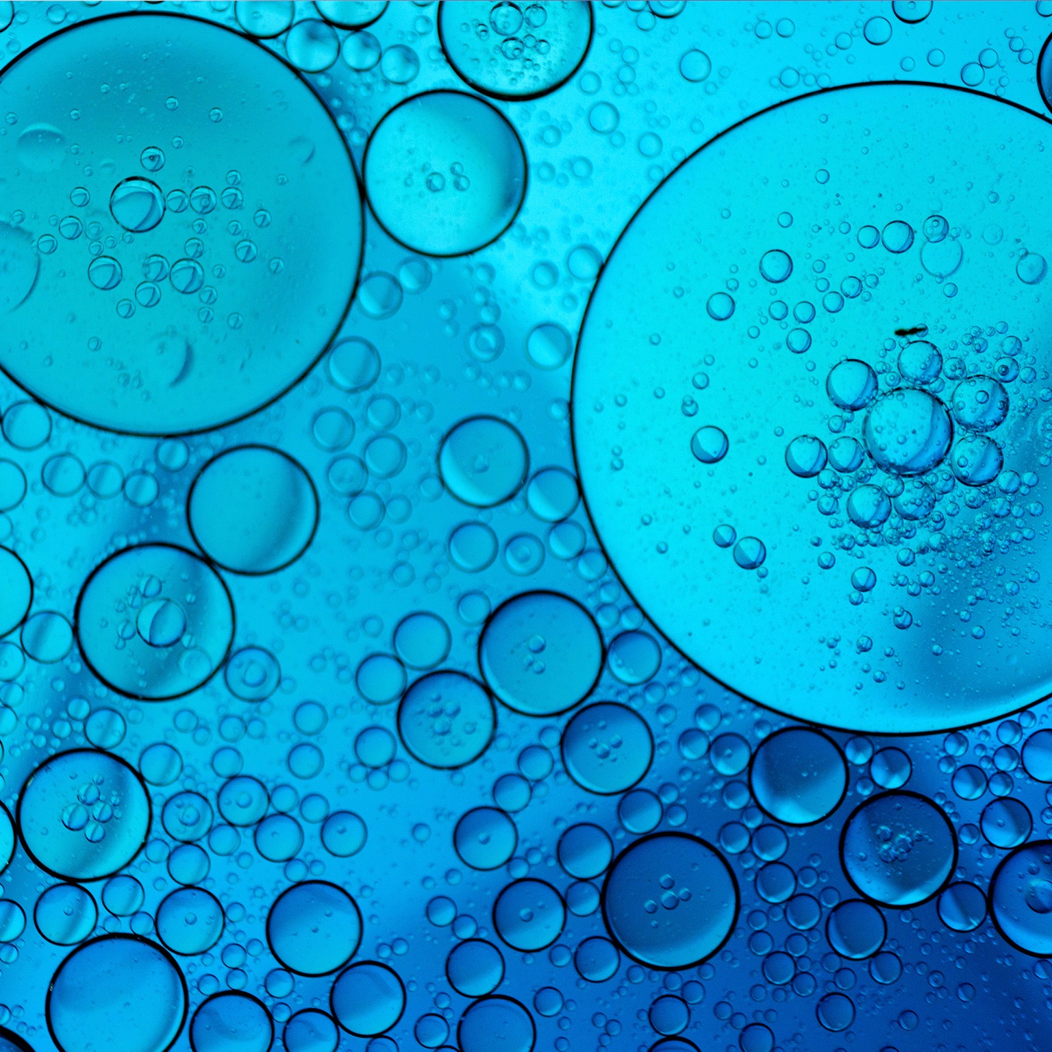 Blue abstract background with oil and water - stock photo
