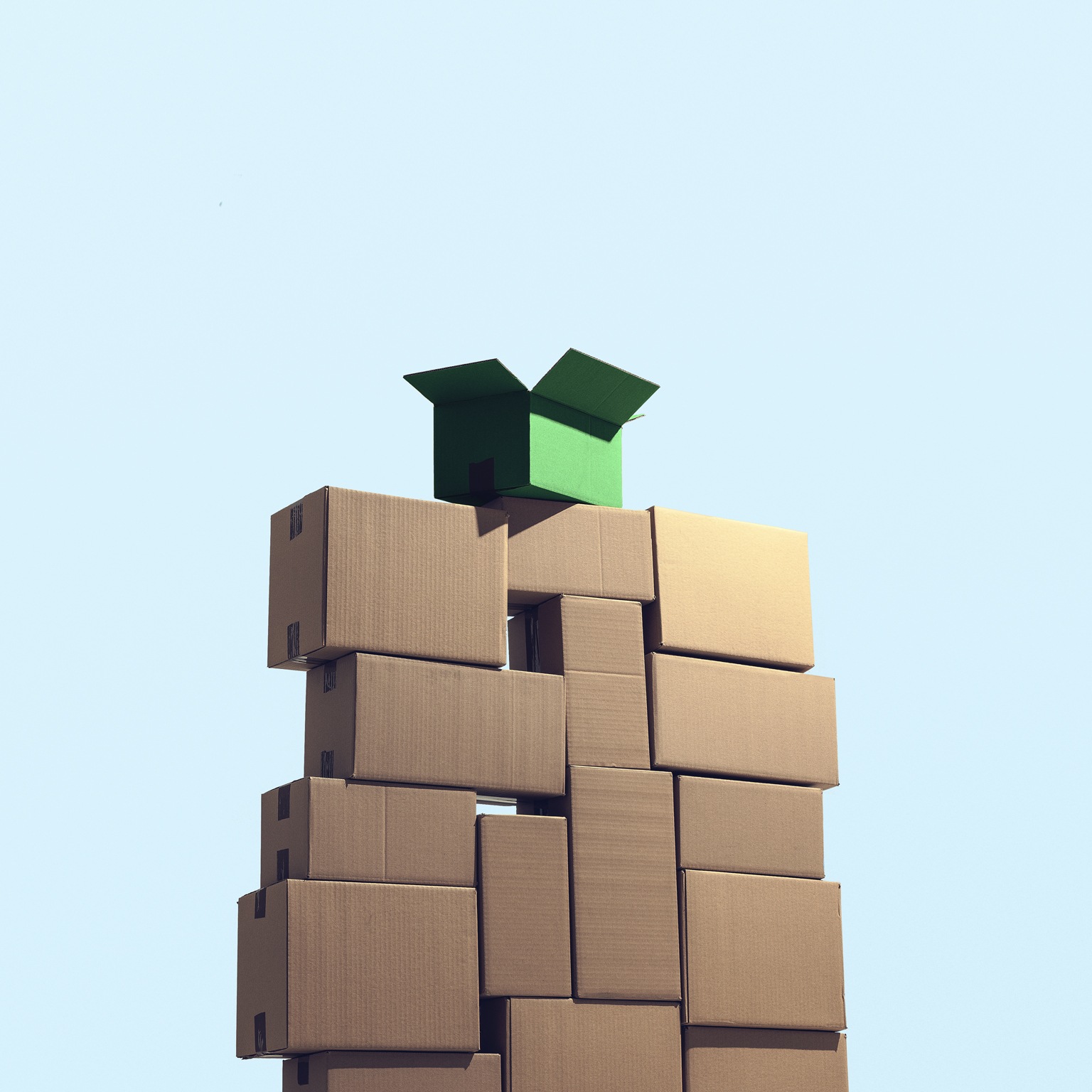 A large pile of cardboard boxes stacked on top of each other