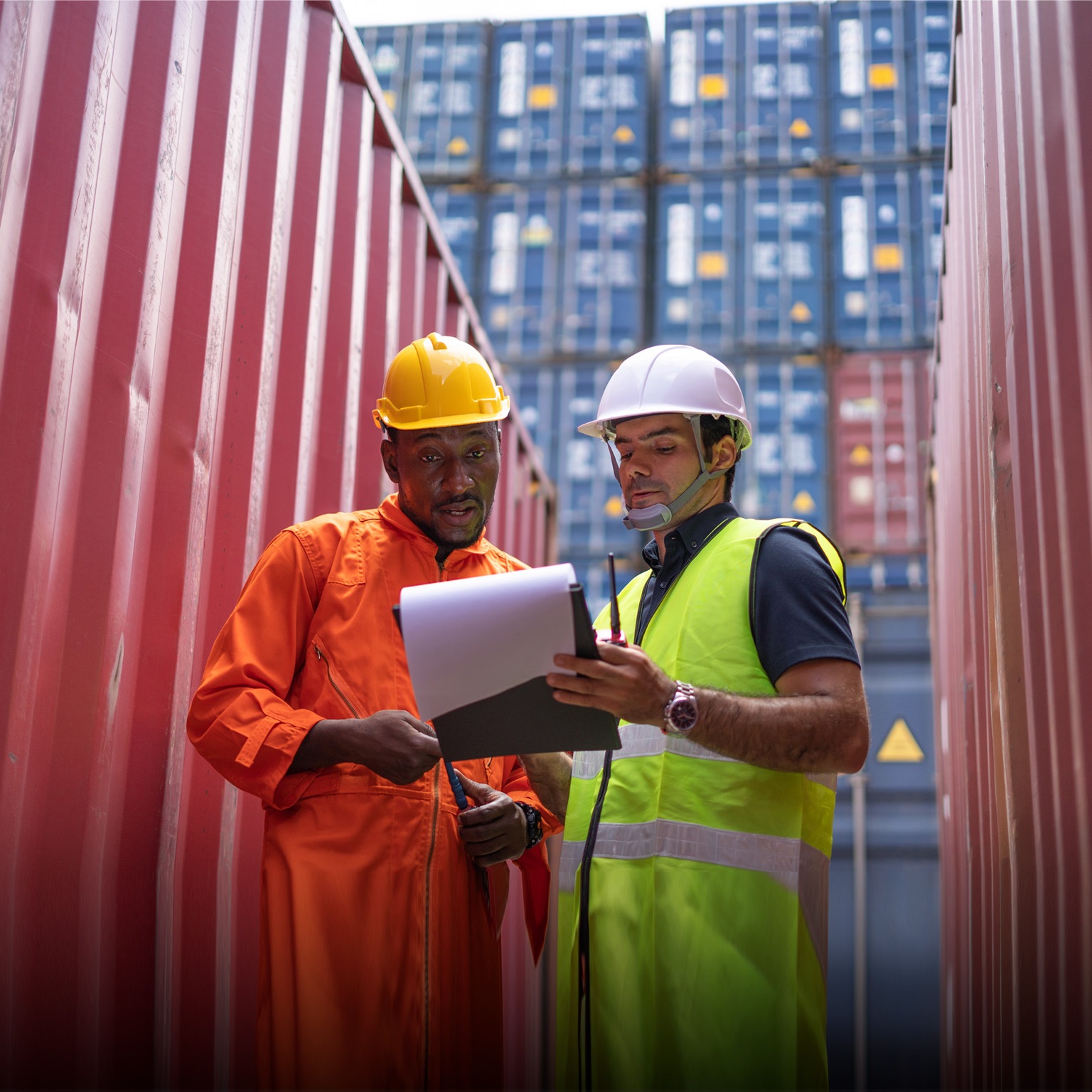 Logistic team checking stock at commercial dock yard. - stock photo