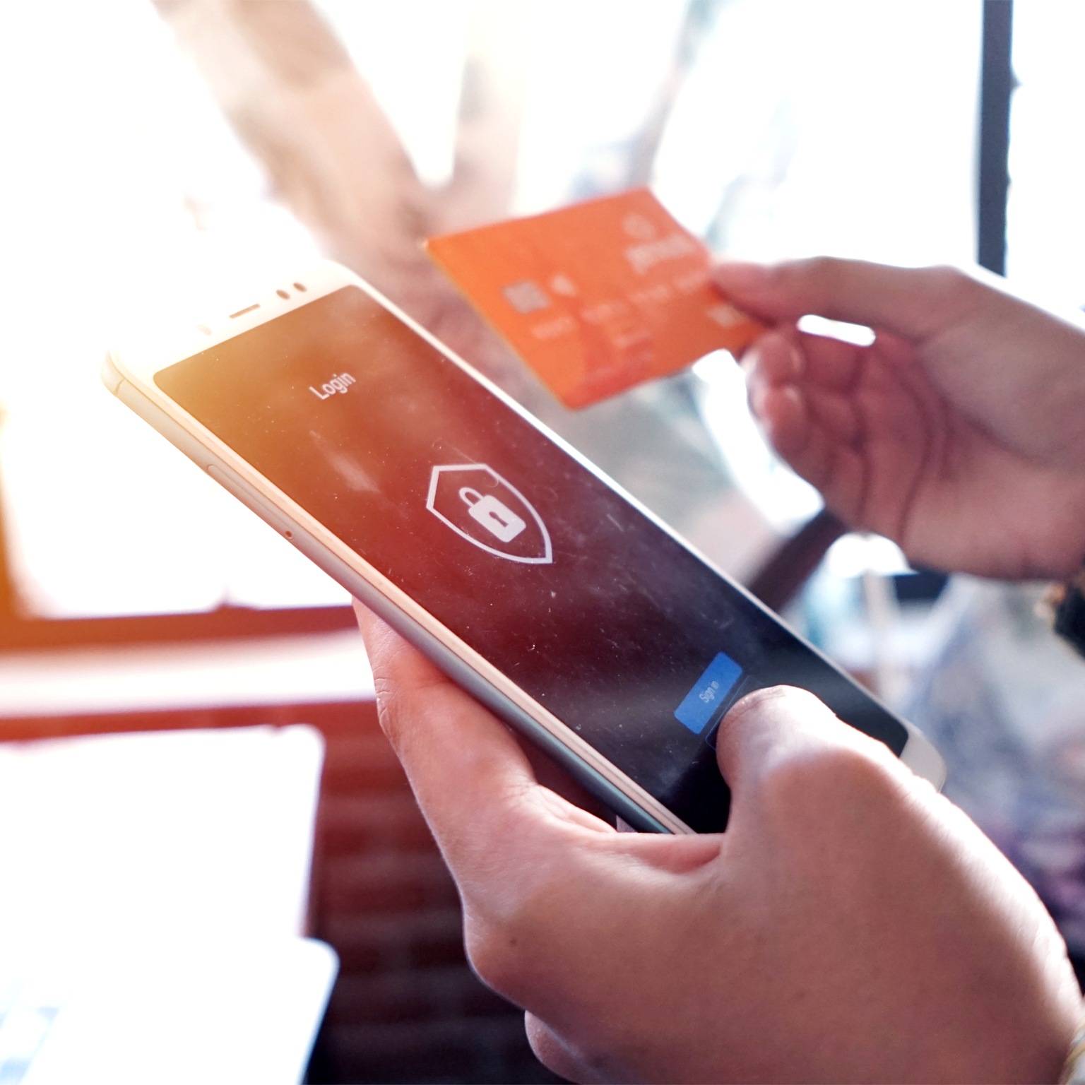Logging into a mobile payment app with an online security system on a smartphone.