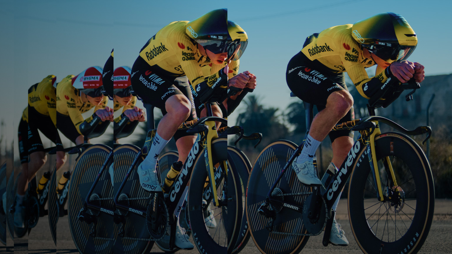 Team Visma | Lease a Bike riders in aerodynamic time-trial positions, racing at speed in a layered composition that emphasizes performance, precision, and momentum.
