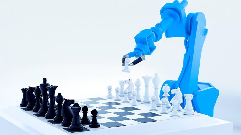 A blue robotic arm playing a game of chess.