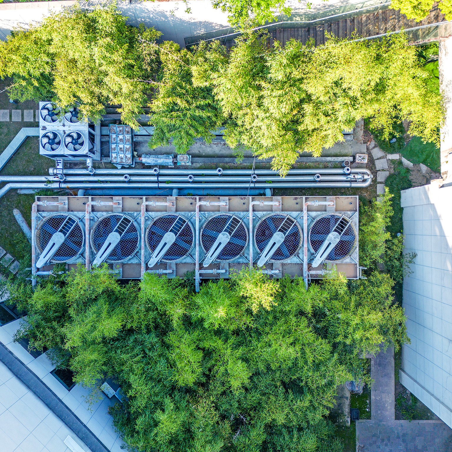 Aerial view of air conditional array in the middle of a building complex.