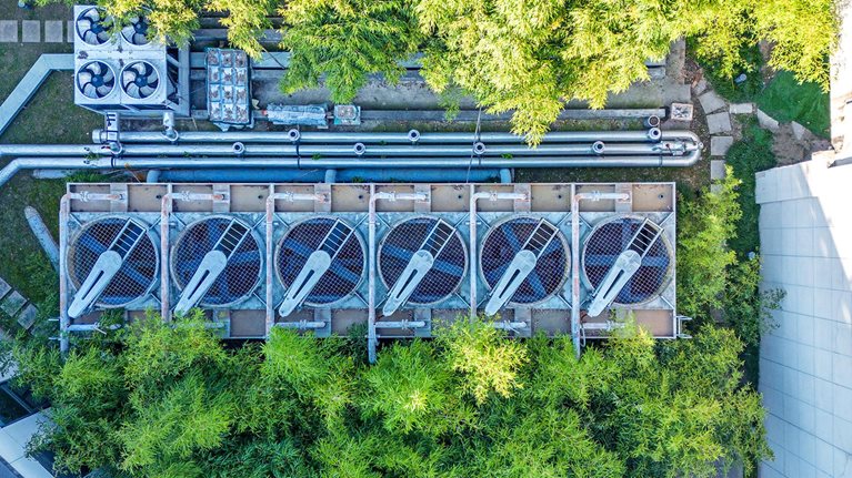 Aerial view of air conditional array in the middle of a building complex.