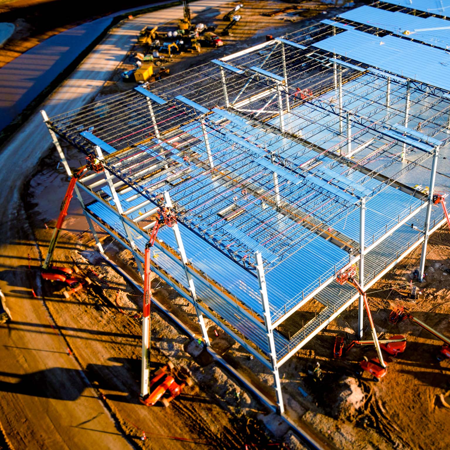 Aerial drone view of an electric vehicle battery factory that is under construction 