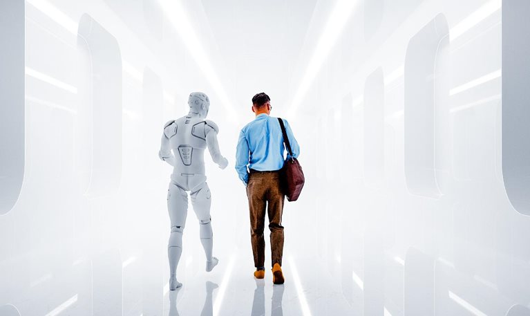 A man dressed in business-casual attire walks side by side with a humanoid robot down a futuristic corridor. The pair are viewed from behind, walking away from the viewer into the brightly lit space.