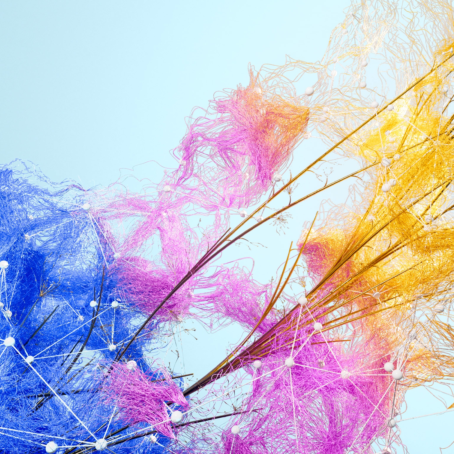 A network of vibrant threads, transitioning from blue to pink to golden yellow, sprouts over a lattice of crisscrossing branches and small white beads, all against a soft blue backdrop.
