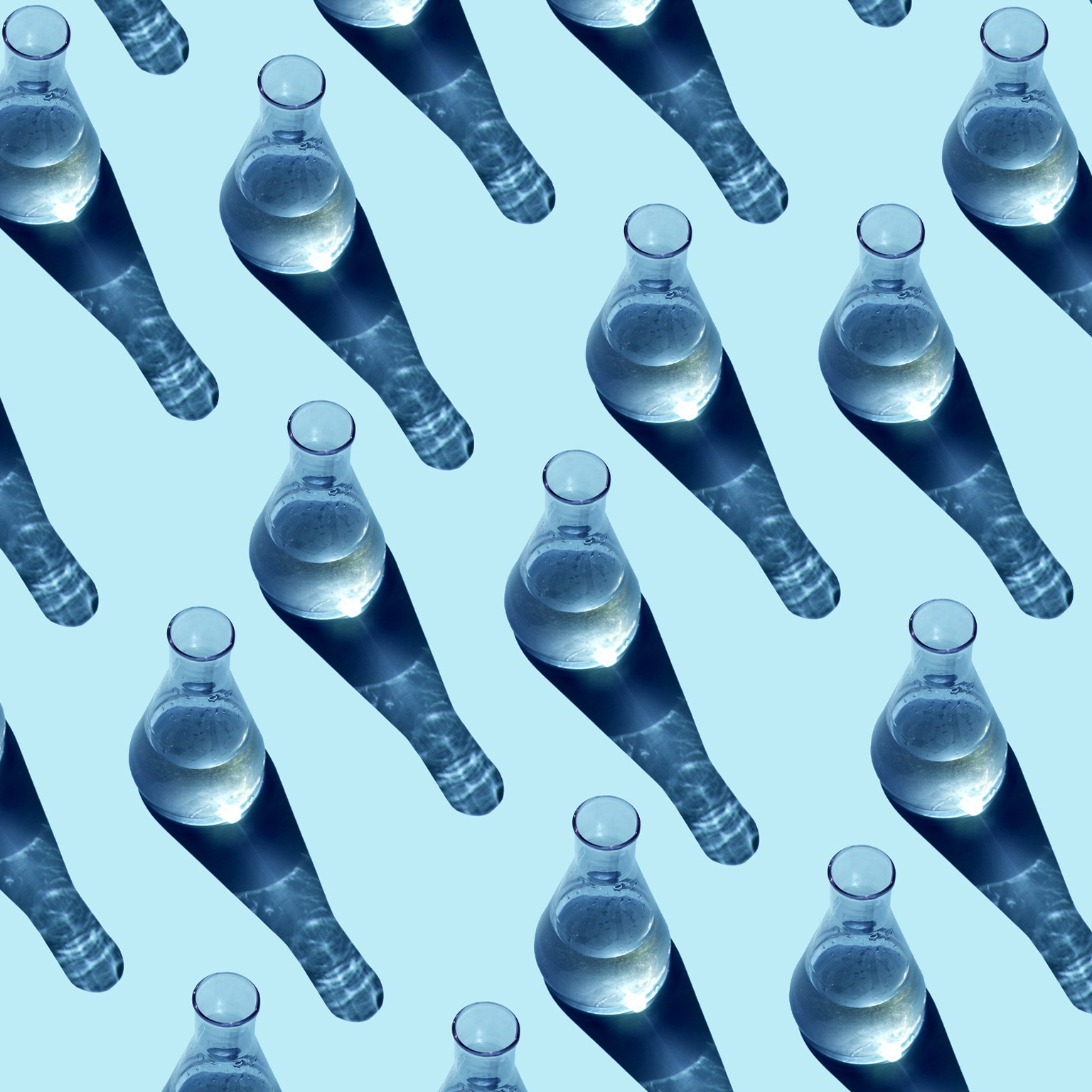 Seamless pattern made from glass beakers on a blue background.