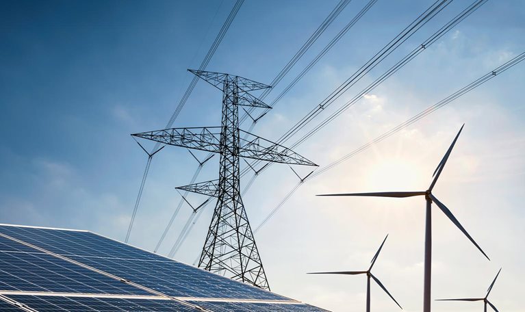 Solar panel with turbine and tower high voltage - stock photo