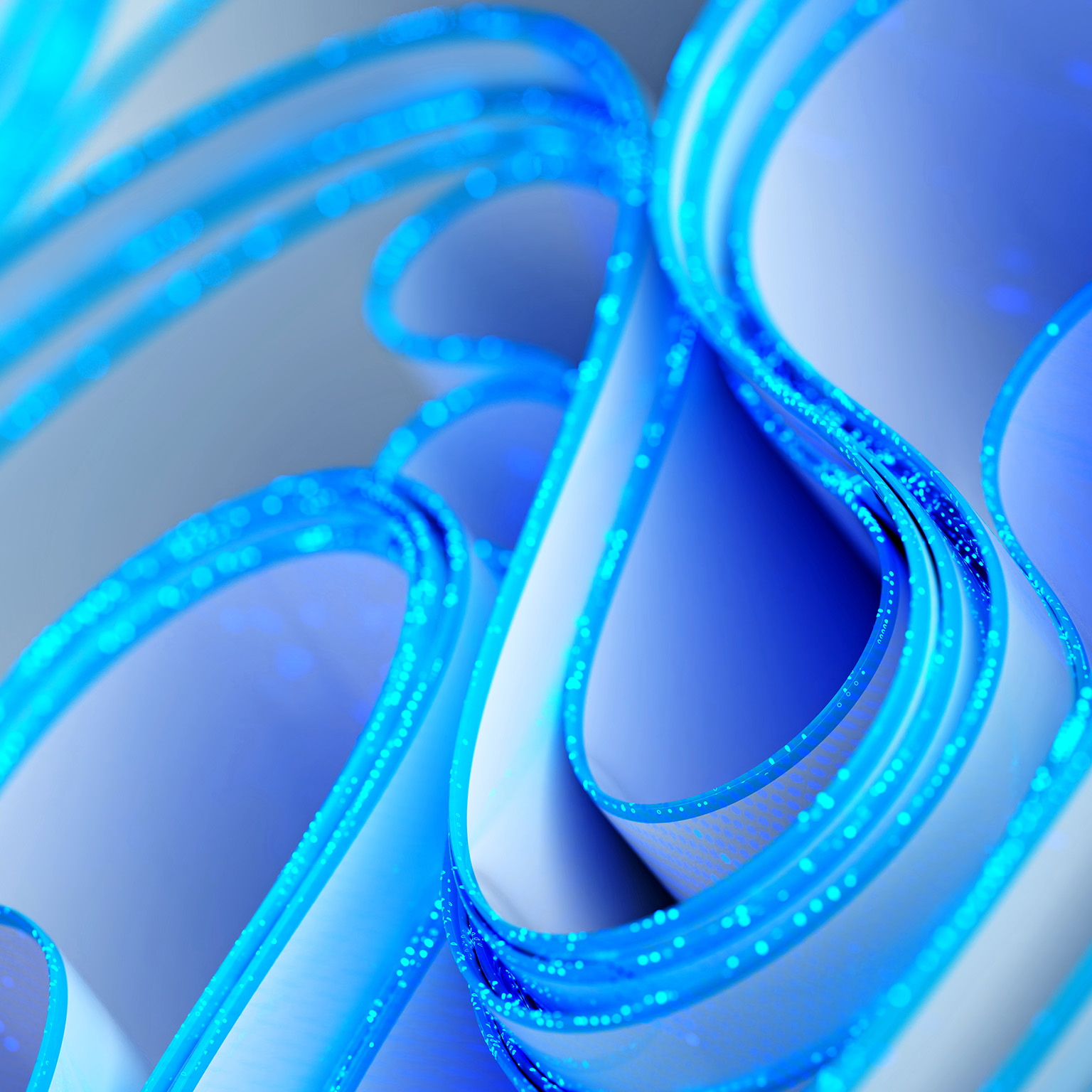 Abstract blue-and-white glowing loops and curved forms, suggesting a futuristic digital network or technology concept.