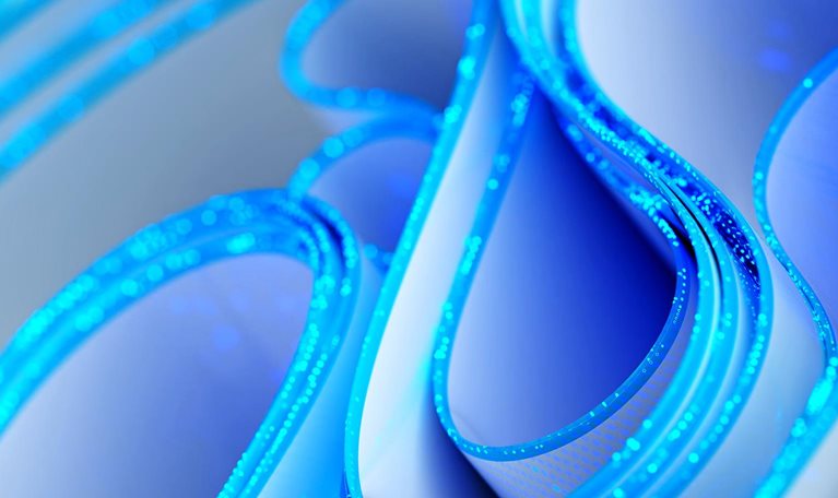 Abstract blue-and-white glowing loops and curved forms, suggesting a futuristic digital network or technology concept.