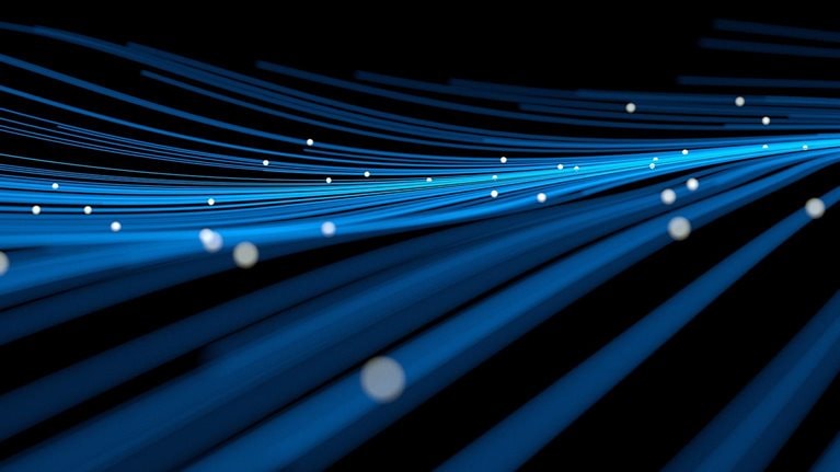 Blue technology background of undulating lines with glowing orbs floating above. - stock photo