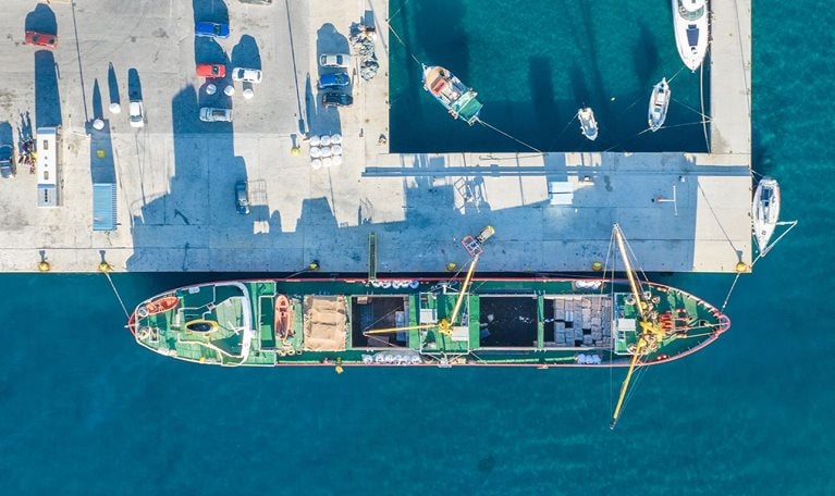 Top down aerial view of a commercial boat at the port - stock photo