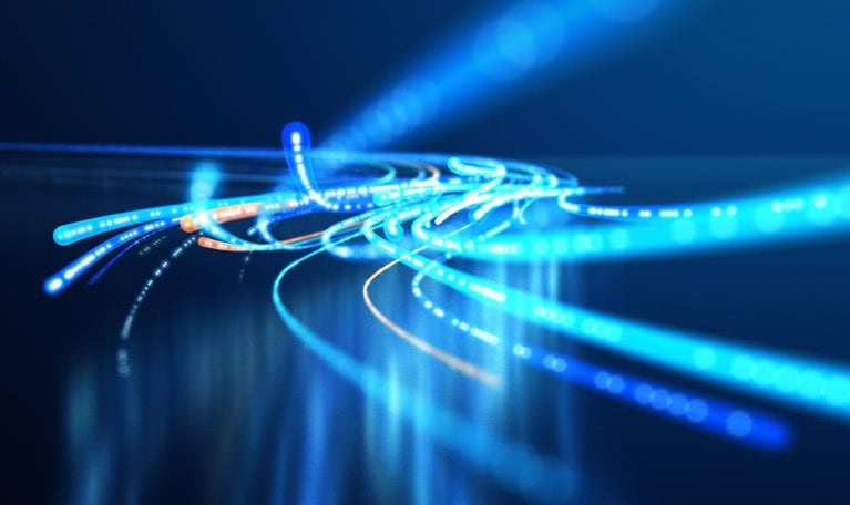 This image is a conceptual representation of fiber optic cables conveying high-speed data. It illustrates the concept of rapid data transmission through network infrastructures.