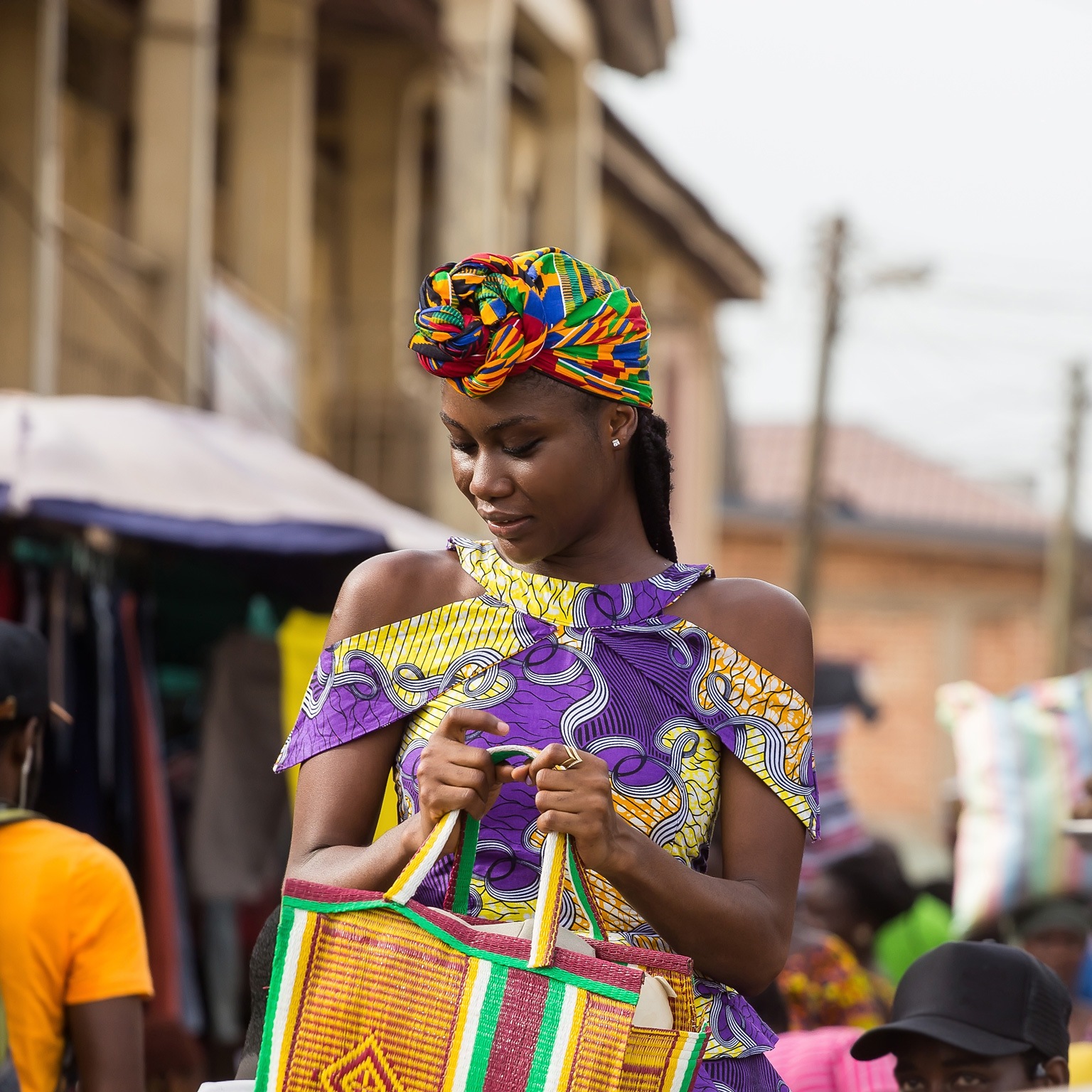 Young woman walking in the market in Accra, Ghana