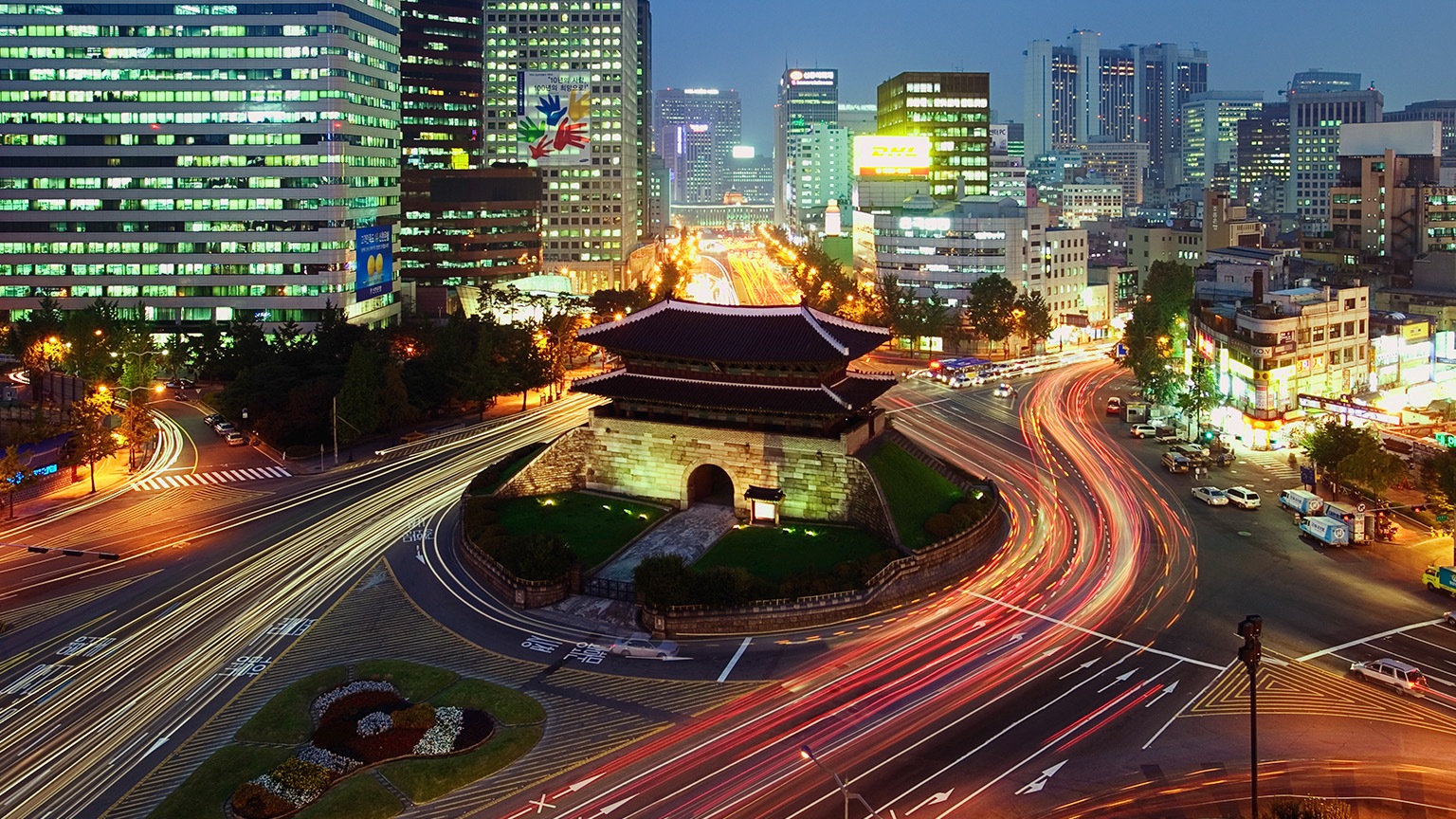 Elevated view of Namdaemun Gate and traffic at dusk in Seoul, South Korea. - stock photo